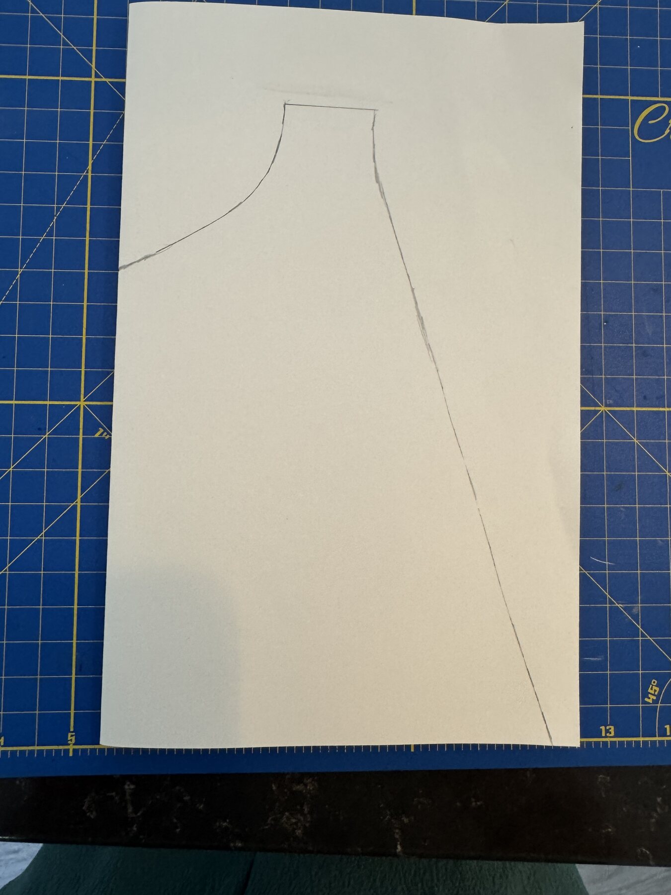 A hand-drawn cape pattern on poster board