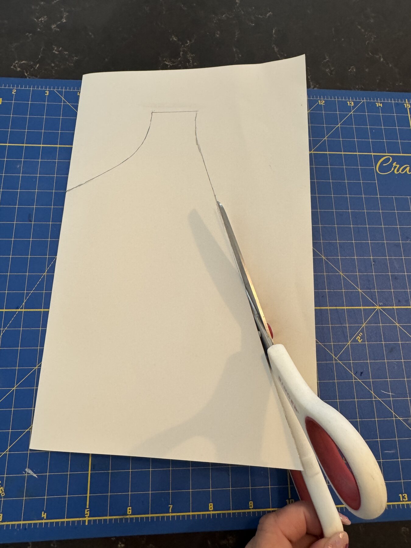 Cutting out the handmade cape pattern