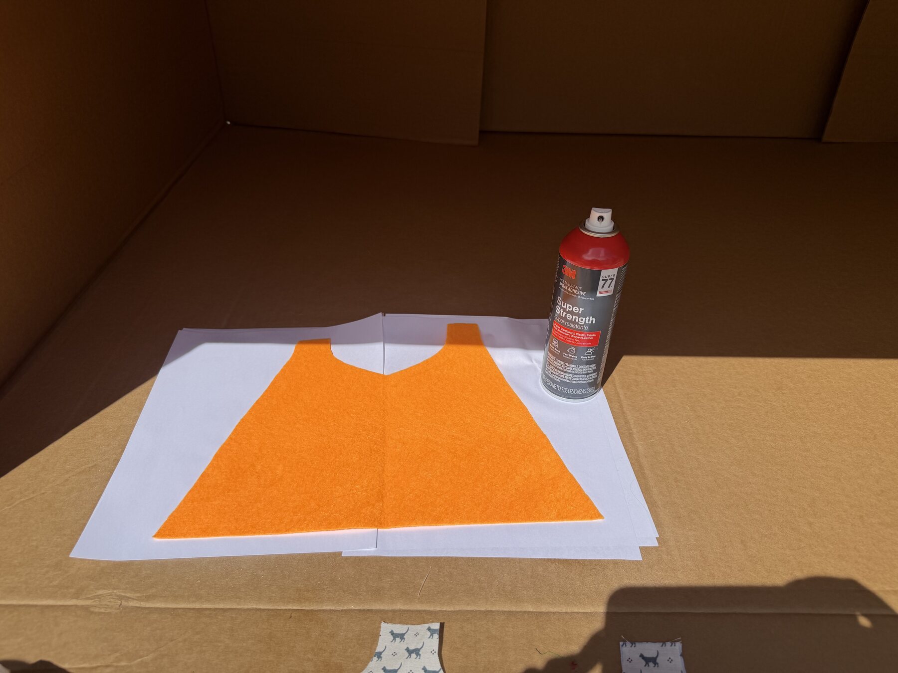 Orange cape material bonded to a white felt backing